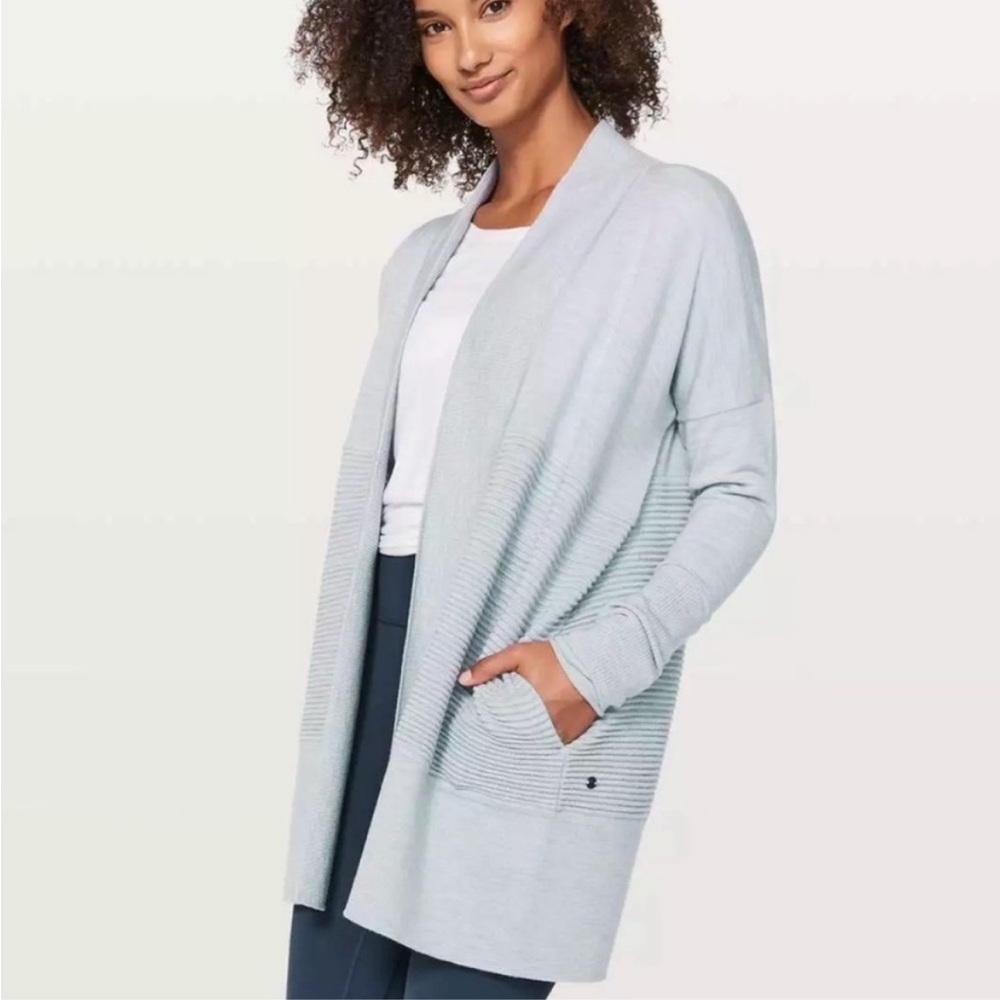 Lululemon sit in Lotus Wrap Cardigan light blue